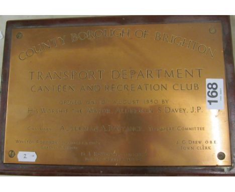 A Brighton Tram Transport Department brass plaque and a Ticket Office sign