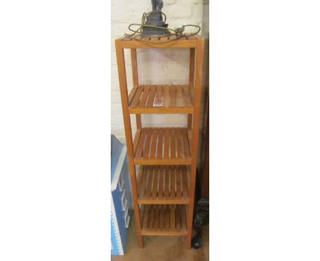 A four tier slatted shelf stand