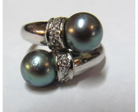 An 18ct gold  Tahitian pearl and diamond ring marked 750 5.7g  size N