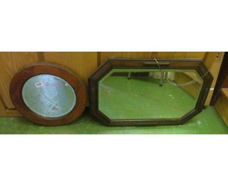 A 1920's oak framed wall mirror and an oak circular mirror