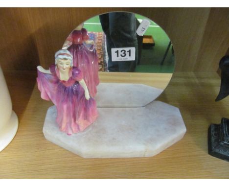 A model of lady on base with mirror back