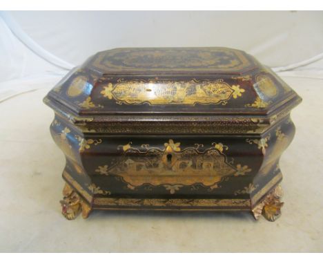 A Chinese lacquer tea caddy pewter internal on gilt feet