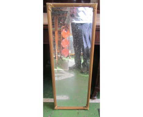 A gilt reeded bevelled mirror
