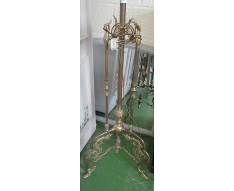A brass floor standing lamp