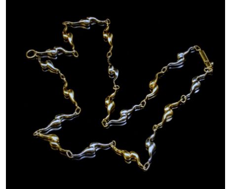 Charles de Temple, a bi-coloured 18ct gold collar necklace, the abstract polished gold marine inspired beads with plain link 