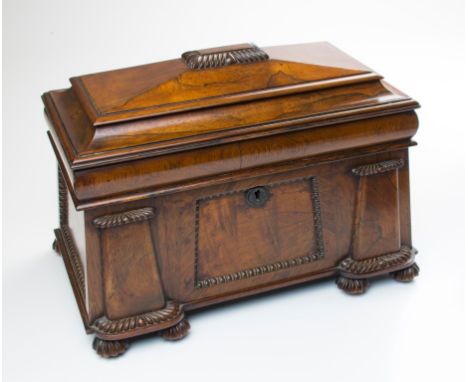 A William IV sarcophagus form rosewood tea caddy with architectural detail, fitted with two hinged lidded tea canisters and a