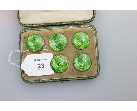 Child and Child, a cased part set of five gilt metal 2.5cm diameter buttons, each with green guilloche enamel decoration