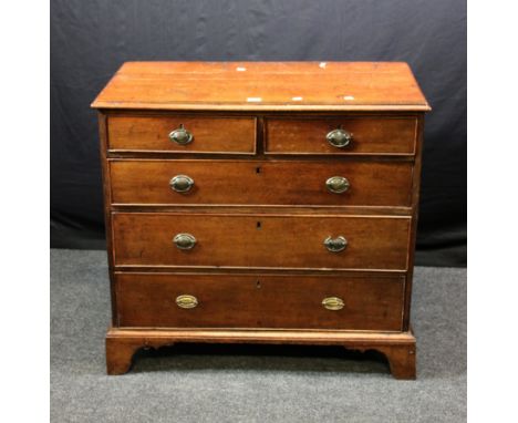 A George III oak chest, the rectangular top with moulded edge over two short and three graduated long drawers, with brass hal