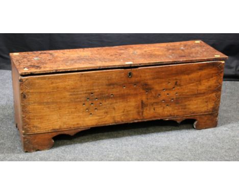 An 18th century elm six plank coffer, with later drilled holes to lid and front with punch work decoration on bracket feet, 4