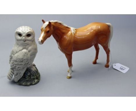 A Beswick pottery figure of a Palomino Horse, 24cm, together with a Royal Doulton whisky decanter modelled by John G Longue f