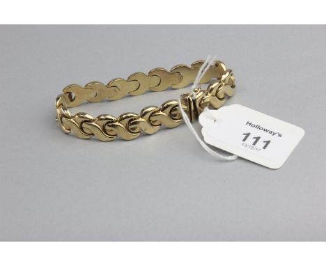 A 9ct gold bracelet, of polished cross-over links to a concealed push button clasp