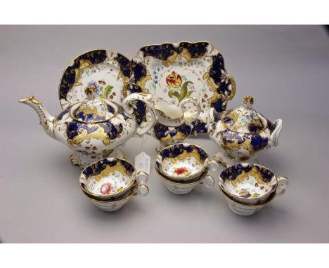 An early 19th century English porcelain part tea service, probably Coalbrookdale, comprising twin handled cake plate, teapot,