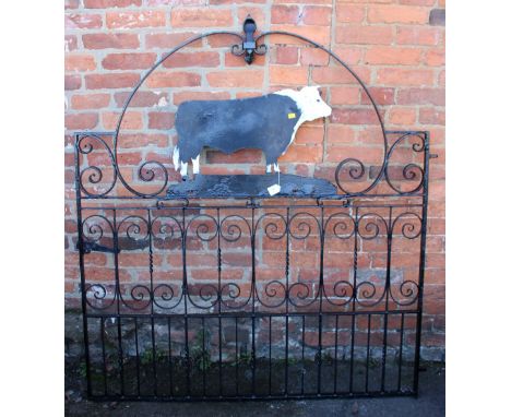 A wrought iron gate, with cut steel bull silhouette, 154 x 137cm