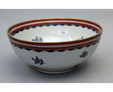 A Samson of Paris Oriental style porcelain punch bowl, painted with blue enamel flowers below a waved band with gilt detail, 