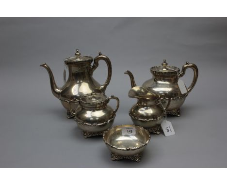 A 20th century Mexican silver (925) five piece tea set, of pot bellied form with scroll handles and decorative moulded detail