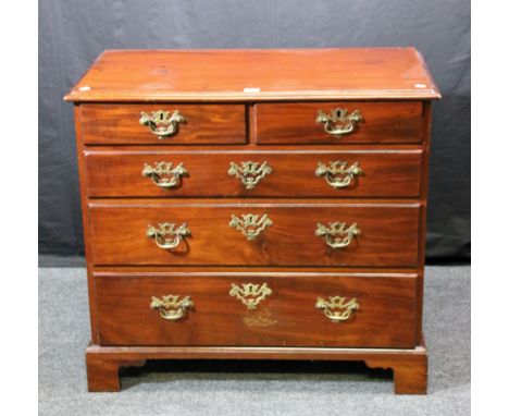 A George III mahogany chest, the rectangular top with moulded edge over two short and three graduated long drawers, with bras
