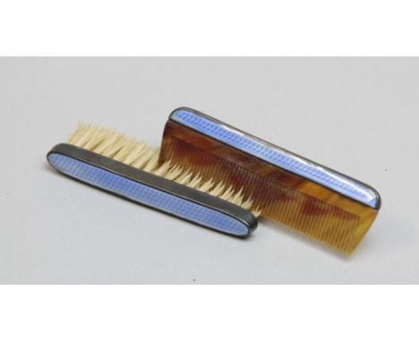 A silver mounted and blue guilloche enamel decorated moustache brush and comb, Birmingham 1926