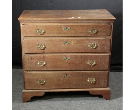 A George III oak chest, the rectangular top with moulded edge, over four graduated long drawers, with brass batswing drop han