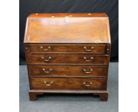 A George III mahogany bureau, the moulded edge fall enclosing a fitted interior over four graduated long drawers with bass sw