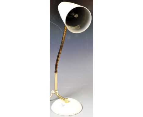 A retro vintage 1950's desk lamp having a white enamel conical shade with brass gooseneck raised on a domed circular white en