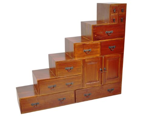 A contemporary late 20th Century step chest. The set of steps comprised of four small pigeon hole section leading down to a s