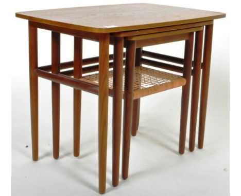 A retro vintage mid 20th Century Danish teak wood nest of three table. The nesting tables having rounded rectangular tops rai