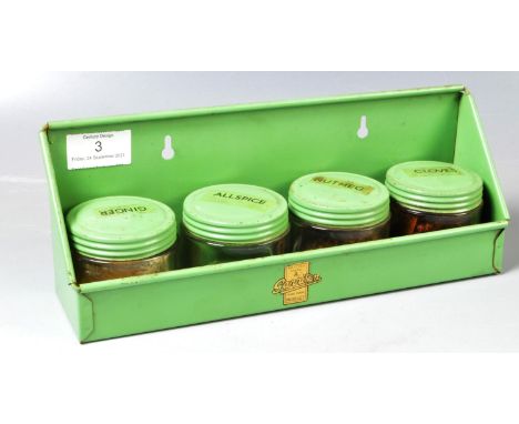 A retro vintage mid 20th Century Garrison made enamel / tin kitchen spice rack complete with a set of four matching glass and