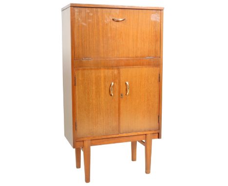 An original retro vintage 1960's teak wood cocktail cabinet / cocktail bar having a two piece opening top section with cockta