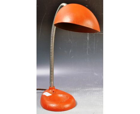 A retro vintage mid 20th Century industrial work desk table lamp light having an orange enamel shade on chrome ribbed goosene