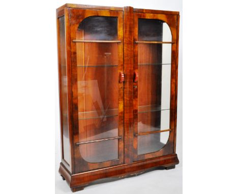 A vintage 20th Century Art Deco&nbsp;walnut china display cabinet having double glazed front doors with red bakelite handles 