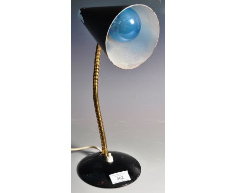 A retro vintage 1960's Italian desk light lamp in the manner of Stilnovo having a black enamel conical shade with brass goose