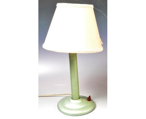 A retro vintage mid 20th Century enamel / metal table desk lamp light having a central tubular column over stepped circular b