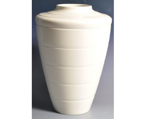 Keith Murray - Wedgwood - A vintage 1930's Art Deco ceramic tapering vase of cylindrical form having a lipped rim and subtle 