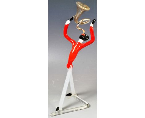 A vintage 20th Century Art Deco French studio art glass figure of musician playing the French horn. Mercury glass to the horn