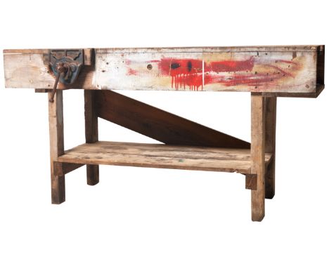 A vintage mid 20th Century large workman's bench of solid pine construction having a stepped channel centre with Record iron 