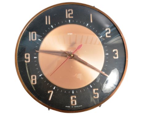Metamec - A retro vintage 1970's wall hanging clock of circular form having a convex glass front with copper surround. The co