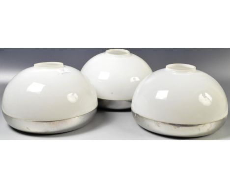 A set of three opaline glass and chrome light / lamp shades in the manner of Harvey Guzzini. White opaline glass shades set t