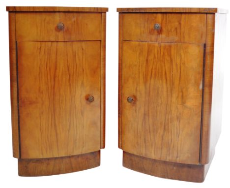 A pair of vintage 1930's Art Deco walnut bedside tables / cupboard chests of bow fronted form with a single drawer over cupbo