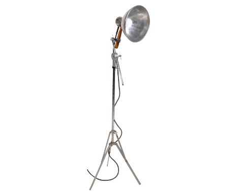 Electro-Medical Supplies - A retro vintage 1950's theatre lamp light raised on an extending tripod base with collapsible legs