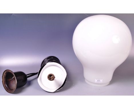A large Art Deco white / milk glass hanging ceiling light shade of bulbous form. Comes with the original hanging ceiling fitt