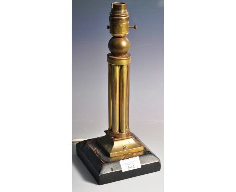 A vintage 20th Century Art Deco table lamp light having a central multi brass cylindrical column having a ball steam top with