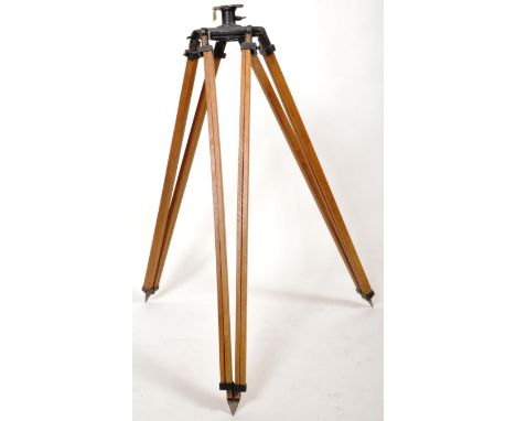 A vintage 20th Century industrial Theodolite tripod base having a metal mounted top with beech extending legs and cast metal 