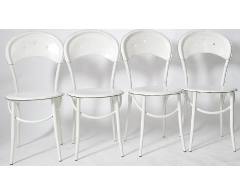 A matching set of four retro vintage 20th Century French Thonet style&nbsp;café bistro dining chairs having tubular metal fra