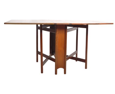 Mcintosh - A retro 1970's teak wood space saving drop leaf dining table having shaped leaves with rounded corners extending o