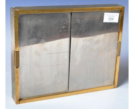 A retro vintage 20th Century mirror brass cigarette dispenser or case having two sliding panels with brass case and interior 