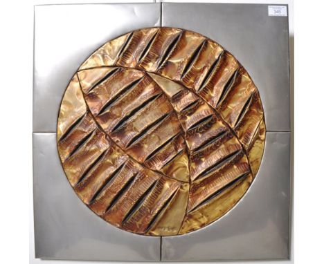 Wetoe - A retro 20th Century 1970's mixed metal brutalist wall art panel having a four section surround with central circular