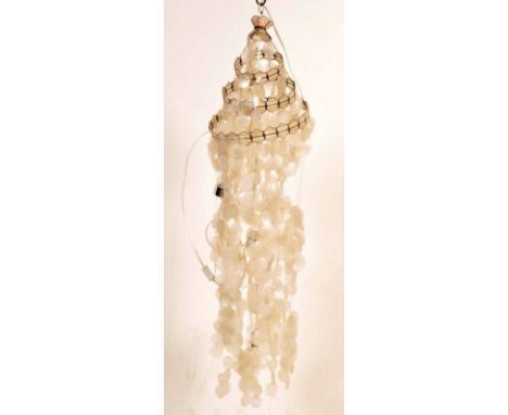 A large 20th century Verner Panton manner mother of pearl disk chandelier. The tall multi-string chandelier being of graduate
