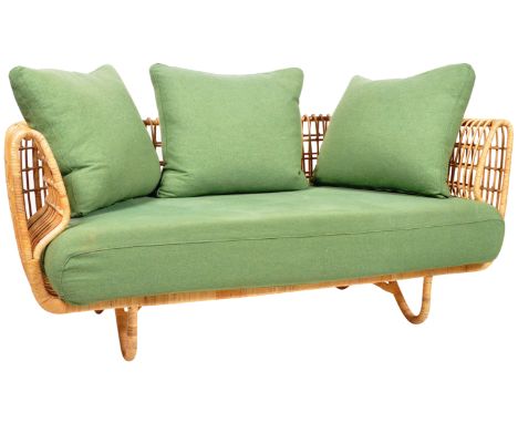 Cane-Line - Nest - A contemporary two seater sofa settee of cane / wicker construction having scrolled back with open magazin