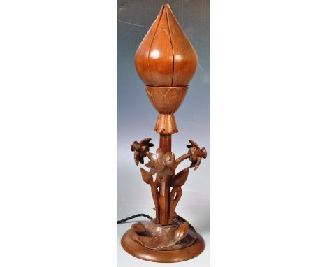 A retro mid 20th Century carved hardwood and mahogany metamorphic desk / table lamp. The top in the form of a lotus flower, w