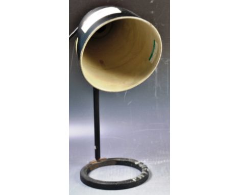 A retro vintage mid 20th Century industrial factory work desk lamp light having a black enamel pendant shade mounted on a lab